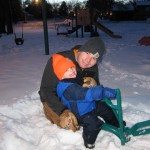 Sledding with his Riding Buddy
